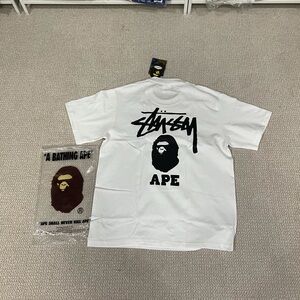 Stussy White Short Sleeve Tee with Black Graphic